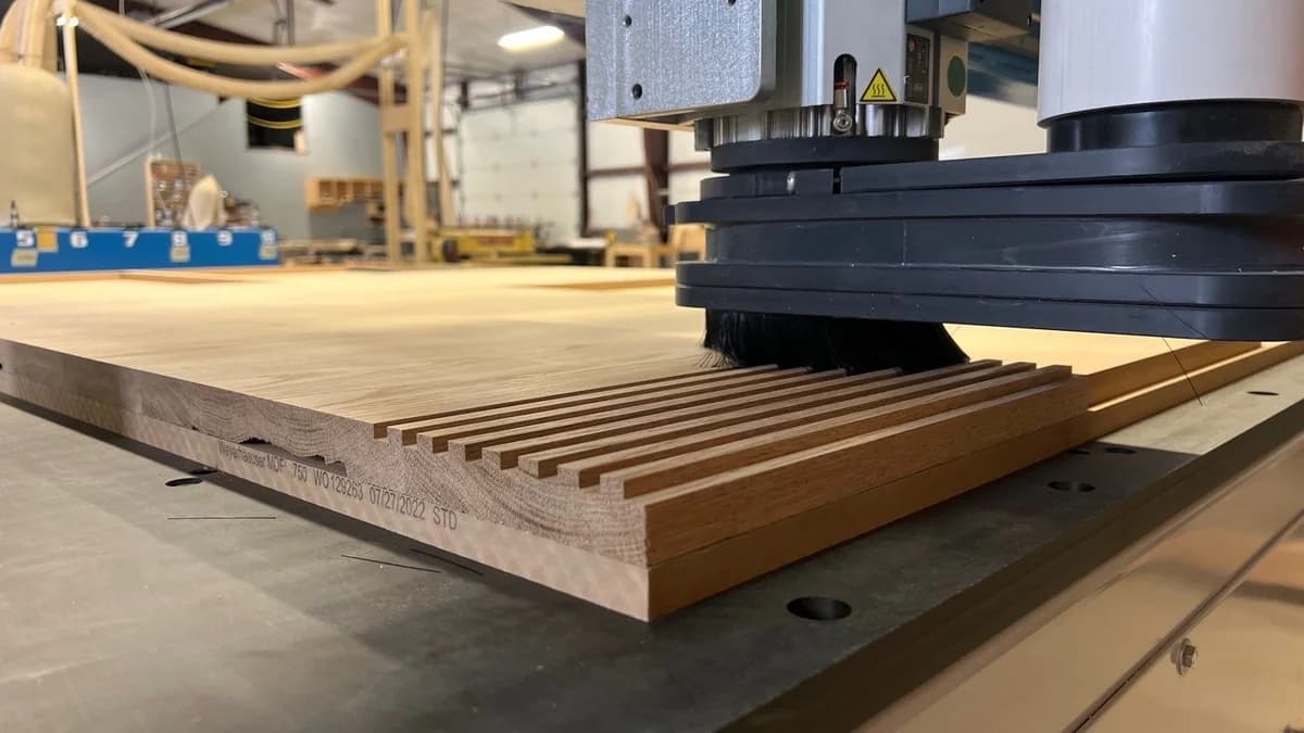 CNC router cutting precision slats in a wood panel